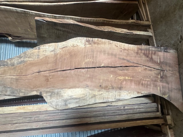 Figured tropical hardwood live-edge slab