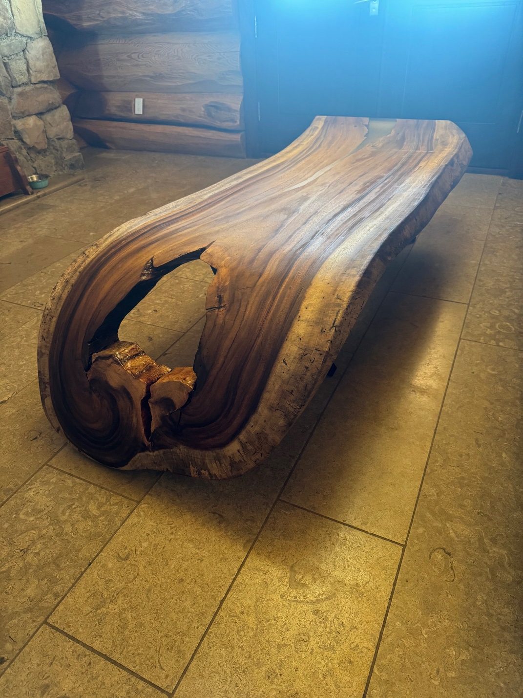 Live-edge dining table with pearl-white epoxy resin and walnut-toned hardwood, by Lost Species
